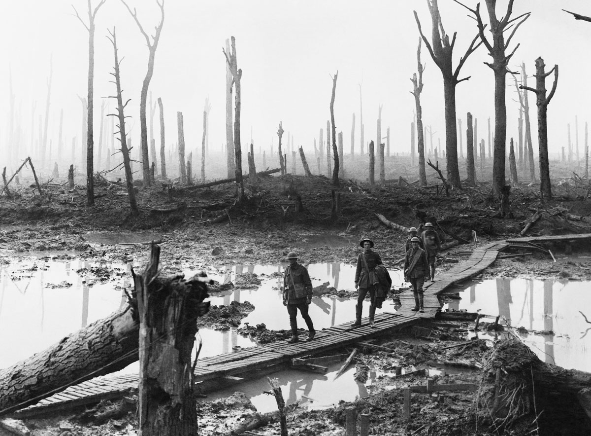 Australian troops walking along duckboards at Chateau Wood in the Ypres Salient, 29 October 1917.